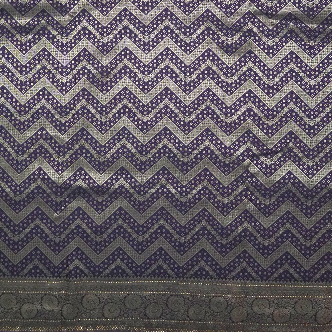 Tarani Silk saree in royal deep purple shade with a rich golden zari weave.