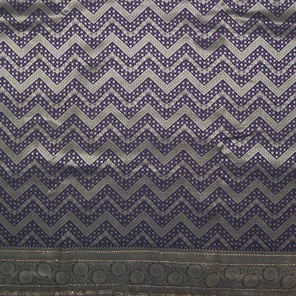 Tarani Silk saree in royal deep purple shade with a rich golden zari weave.