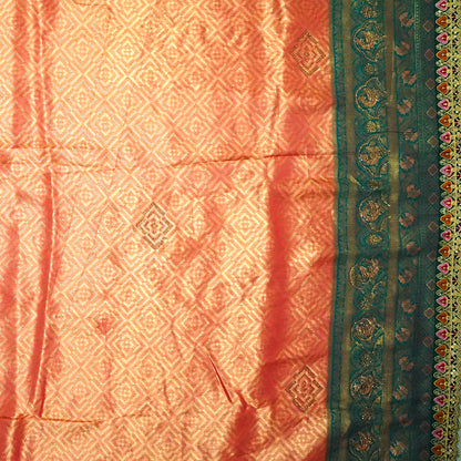Peach-orange Raj Virasat Silk saree with Deep purple base and heavy embroidery.