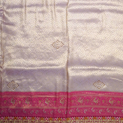 Royal lavender-pink Raj Virasat silk saree with floral motifs and zari works