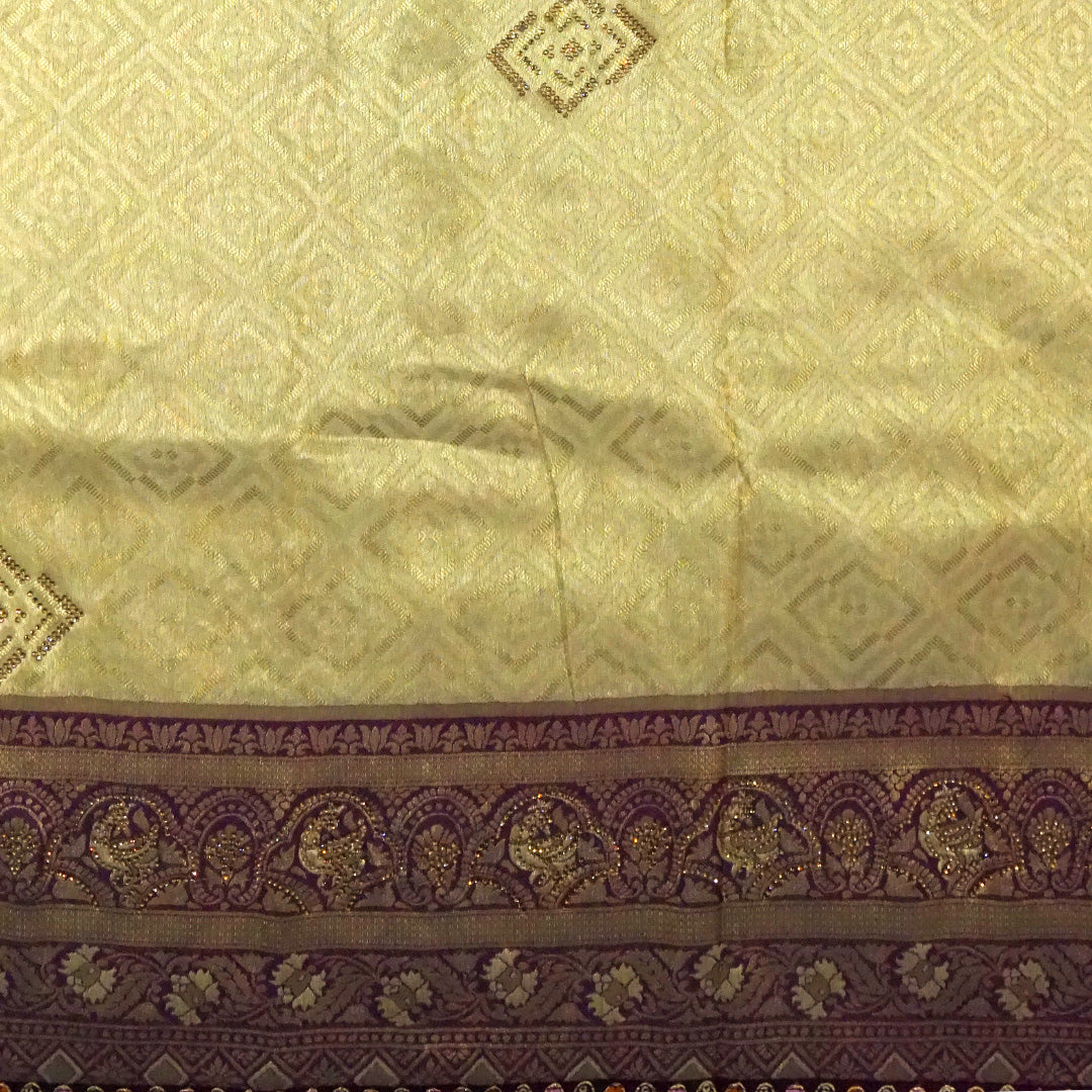 Golden cream Raj Virasat Silk saree with Deep purple base and heavy embroidery.
