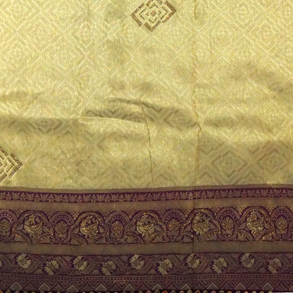 Golden cream Raj Virasat Silk saree with Deep purple base and heavy embroidery.