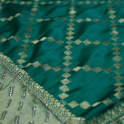 Samrudhi silk saree in vibrant combination of emerald green and lime green with a lustrous Banarasi silk finish.