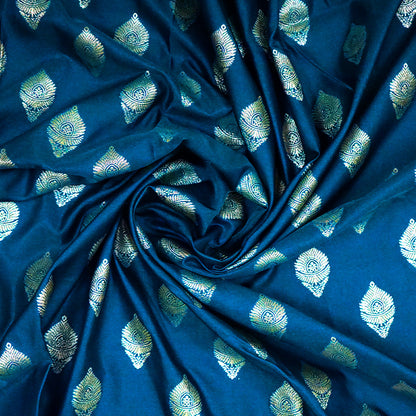 Rithvi Satin Aqua blue color adorned with intricate golden zari embroidery
