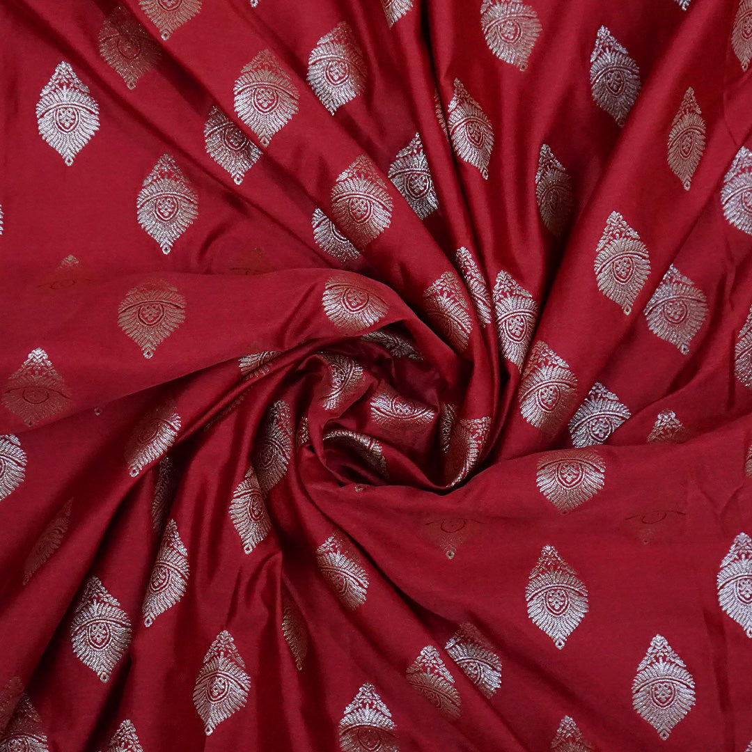 Rithvi Satin Deep red color adorned with intricate golden zari embroidery