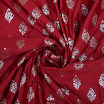 Rithvi Satin Deep red color adorned with intricate golden zari embroidery