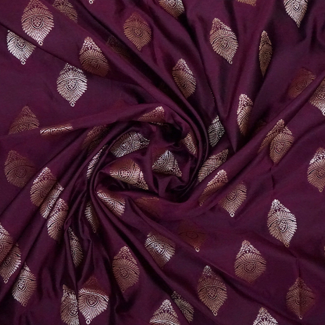 Rithvi Satin Deep plum shade color adorned with intricate golden zari embroidery