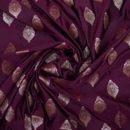 Rithvi Satin Deep plum shade color adorned with intricate golden zari embroidery