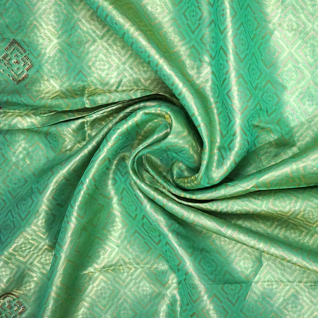 Mint Green Raj Virasat Silk saree with Deep purple base and heavy embroidery.