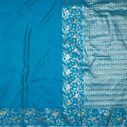 Hamsini Silk saree in Vibrant teal blue shade with a lustrous silk texture.