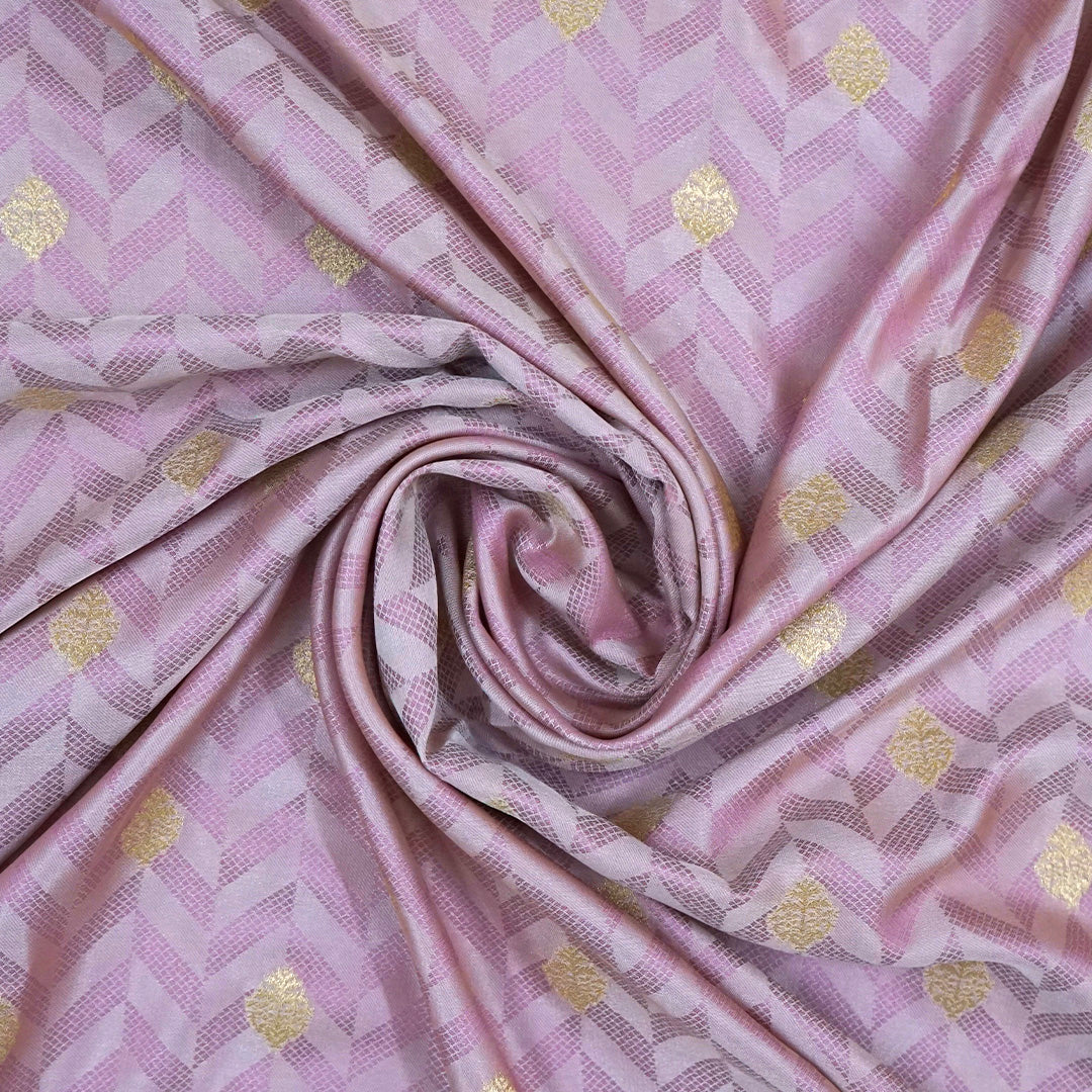 Vedika Silk saree in soft pastel pink shade with a luxurious golden zari weave.