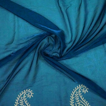 Ratnalekha silk saree in rich teal-blue base adorned with intricate gold zari work,