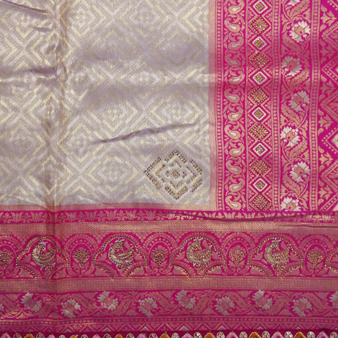 Royal lavender-pink Raj Virasat silk saree with floral motifs and zari works