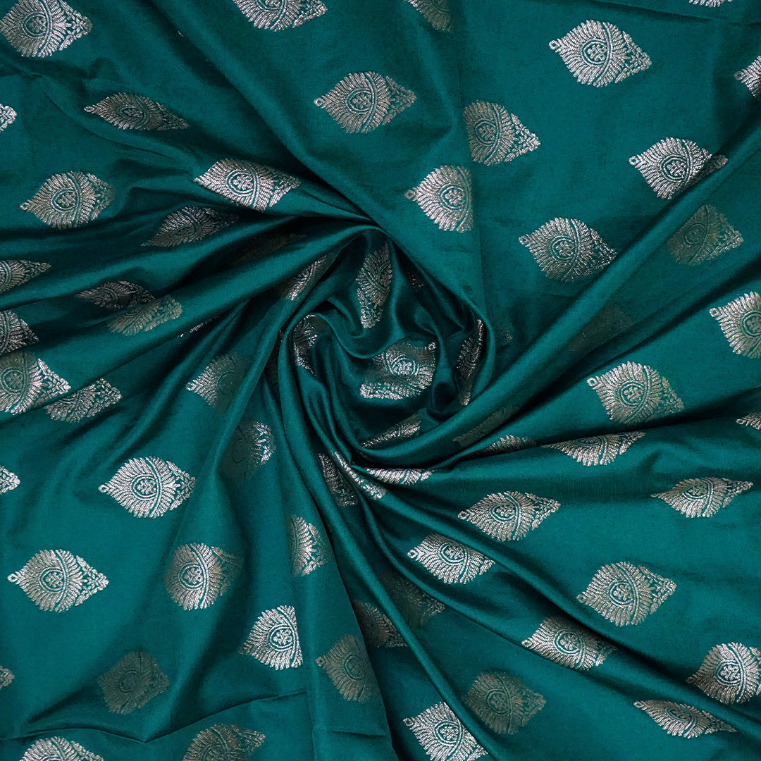 Rithvi Satin Teal blue color adorned with intricate golden zari embroidery