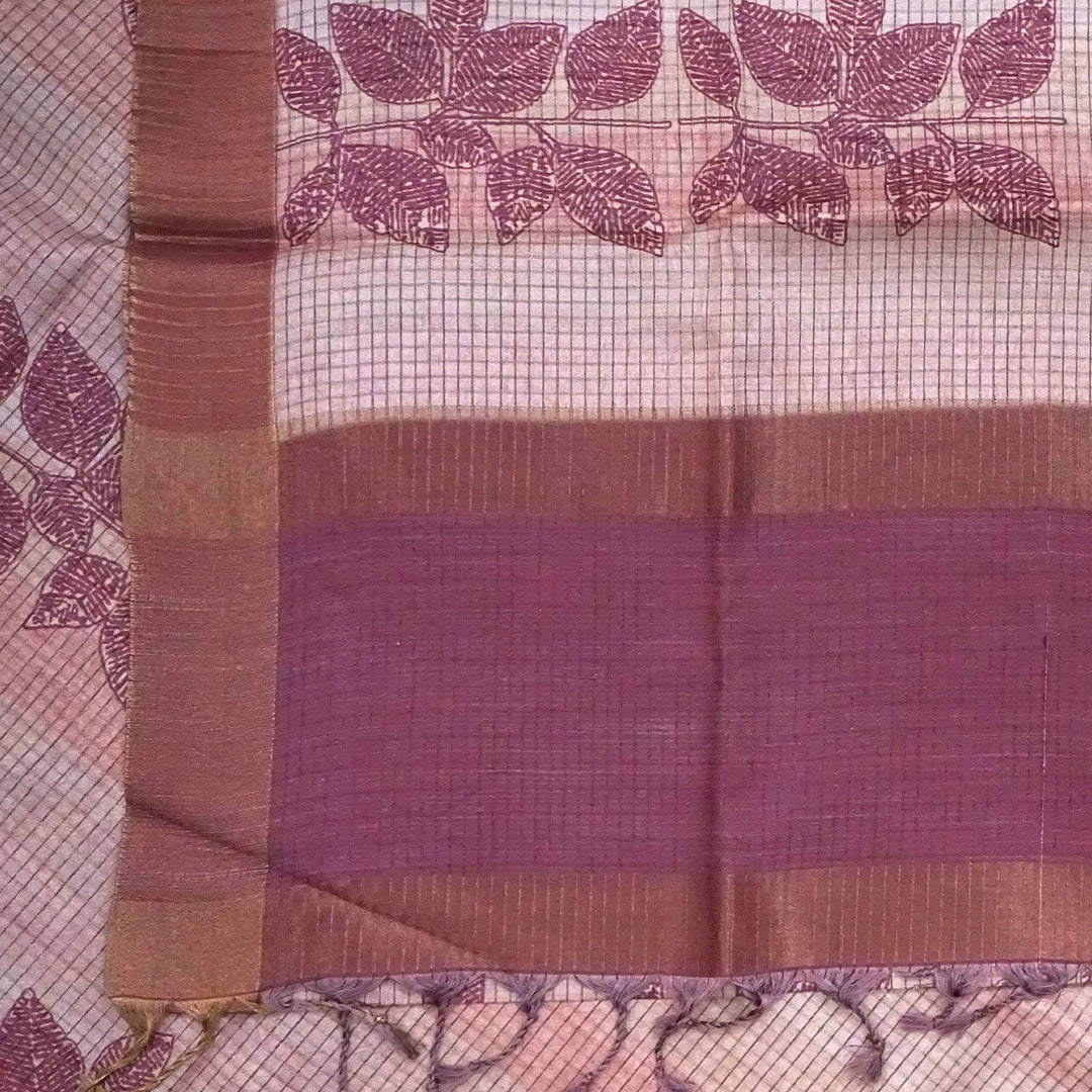 Harini Tussar in soft beige base with maroon leaf motifs and a matching brownish-maroon border, creating an elegant and earthy look.
