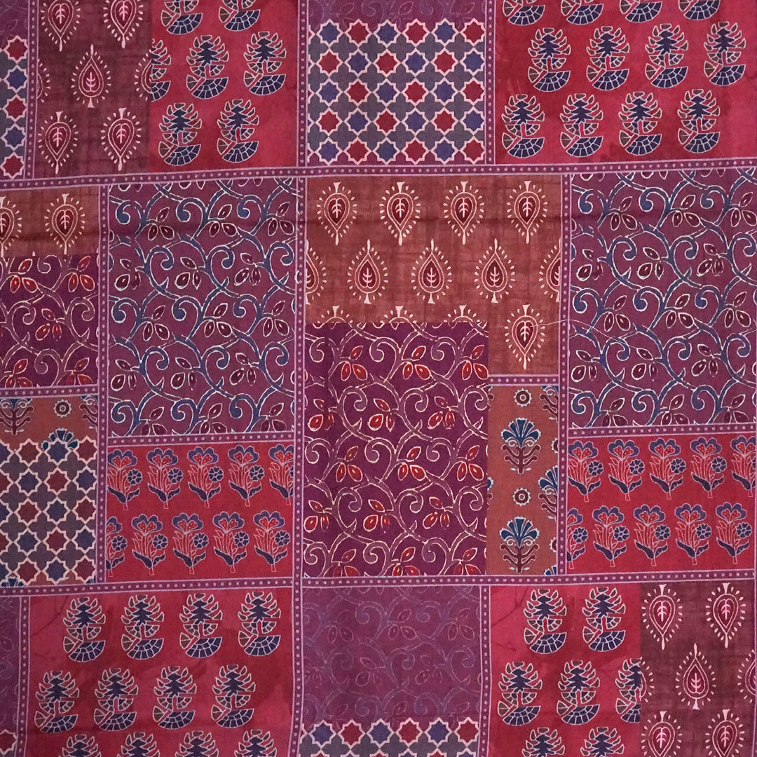 Tanvi in Multicoloured patterns in Rich Maroon Base with hues of Blue, White and Orange