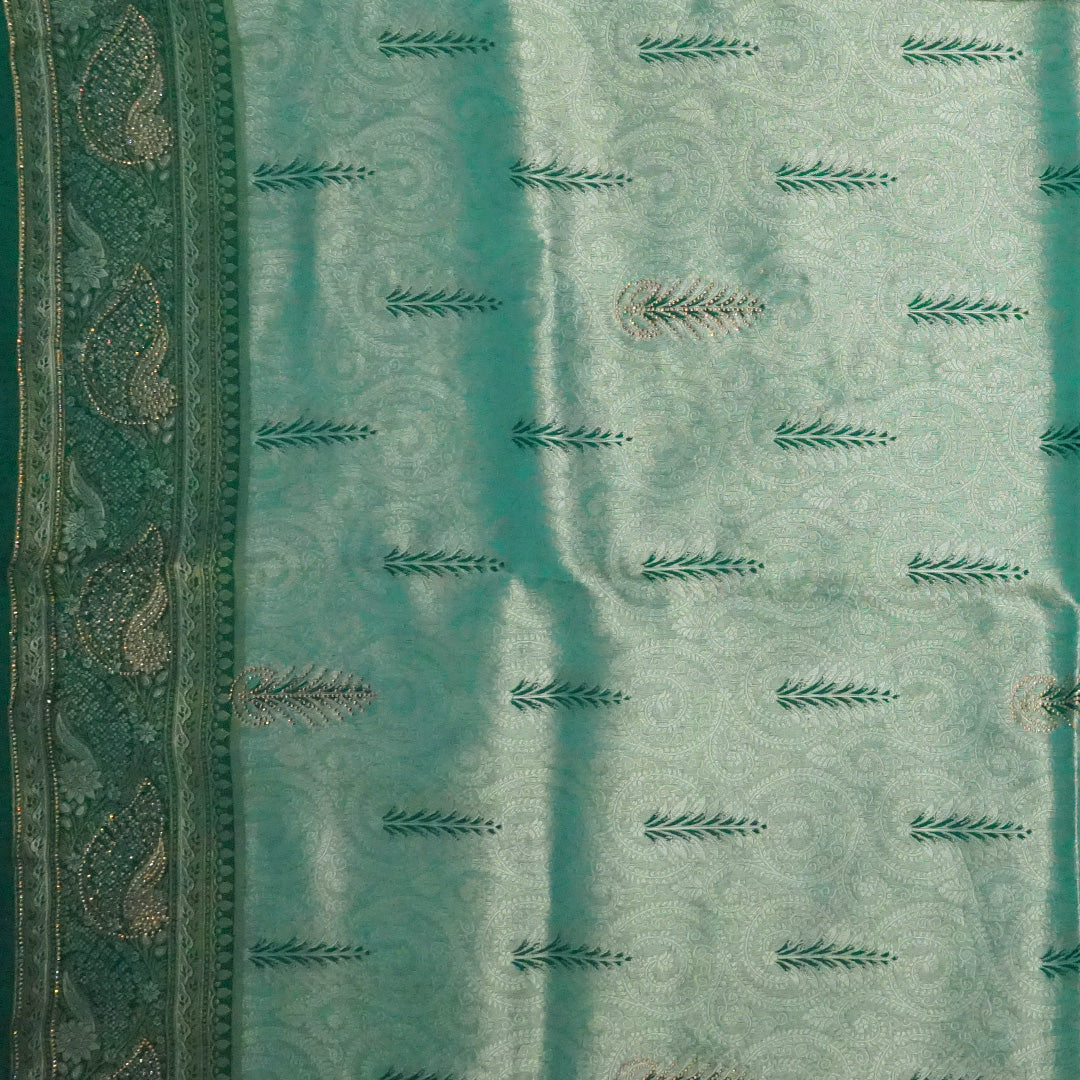 Madhur Bela soothing teal-green hue shade with a golden undertone.