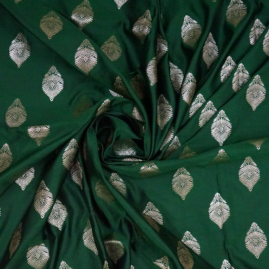 Rithvi Satin Emerald-green shade color adorned with intricate golden zari embroidery