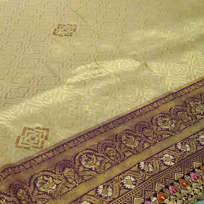 Golden cream Raj Virasat Silk saree with Deep purple base and heavy embroidery.