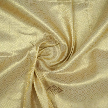 Golden cream Raj Virasat Silk saree with Deep purple base and heavy embroidery.