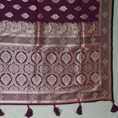 Rithvi Satin Deep plum shade color adorned with intricate golden zari embroidery