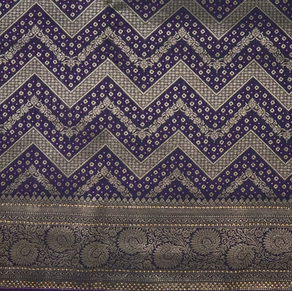 Tarani Silk saree in royal deep purple shade with a rich golden zari weave.