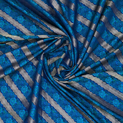 Megha Silk saree in rich royal blue with alternating metallic gold zari stripes.