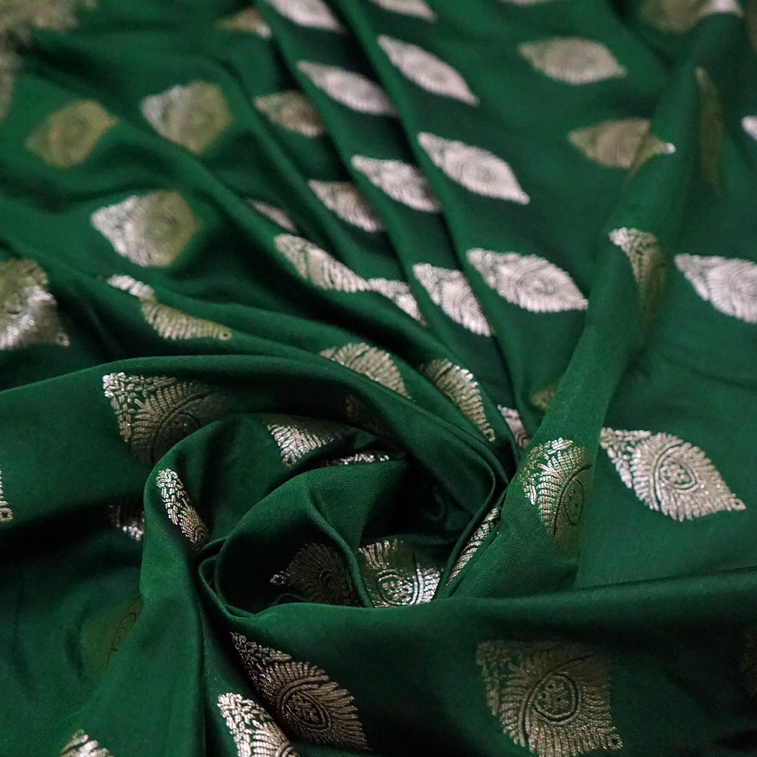 Rithvi Satin Emerald-green shade color adorned with intricate golden zari embroidery