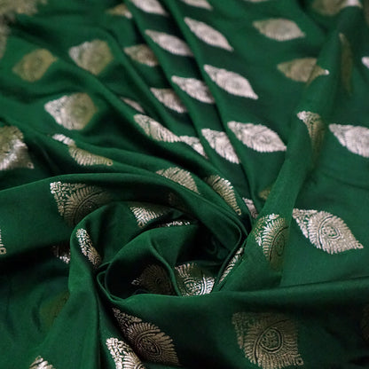 Rithvi Satin Emerald-green shade color adorned with intricate golden zari embroidery
