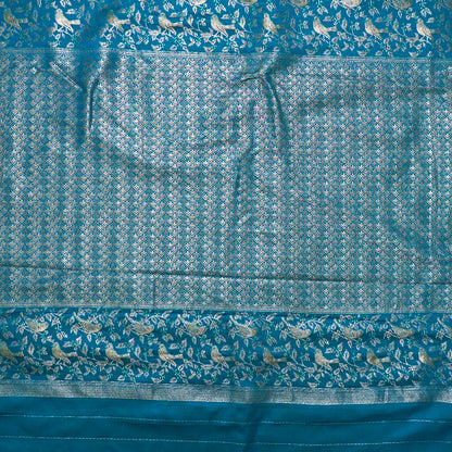Hamsini Silk saree in Vibrant teal blue shade with a lustrous silk texture.