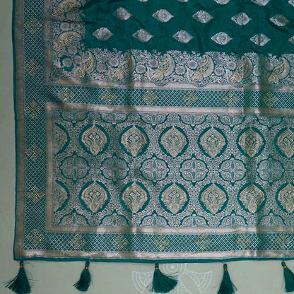 Rithvi Satin Teal blue color adorned with intricate golden zari embroidery
