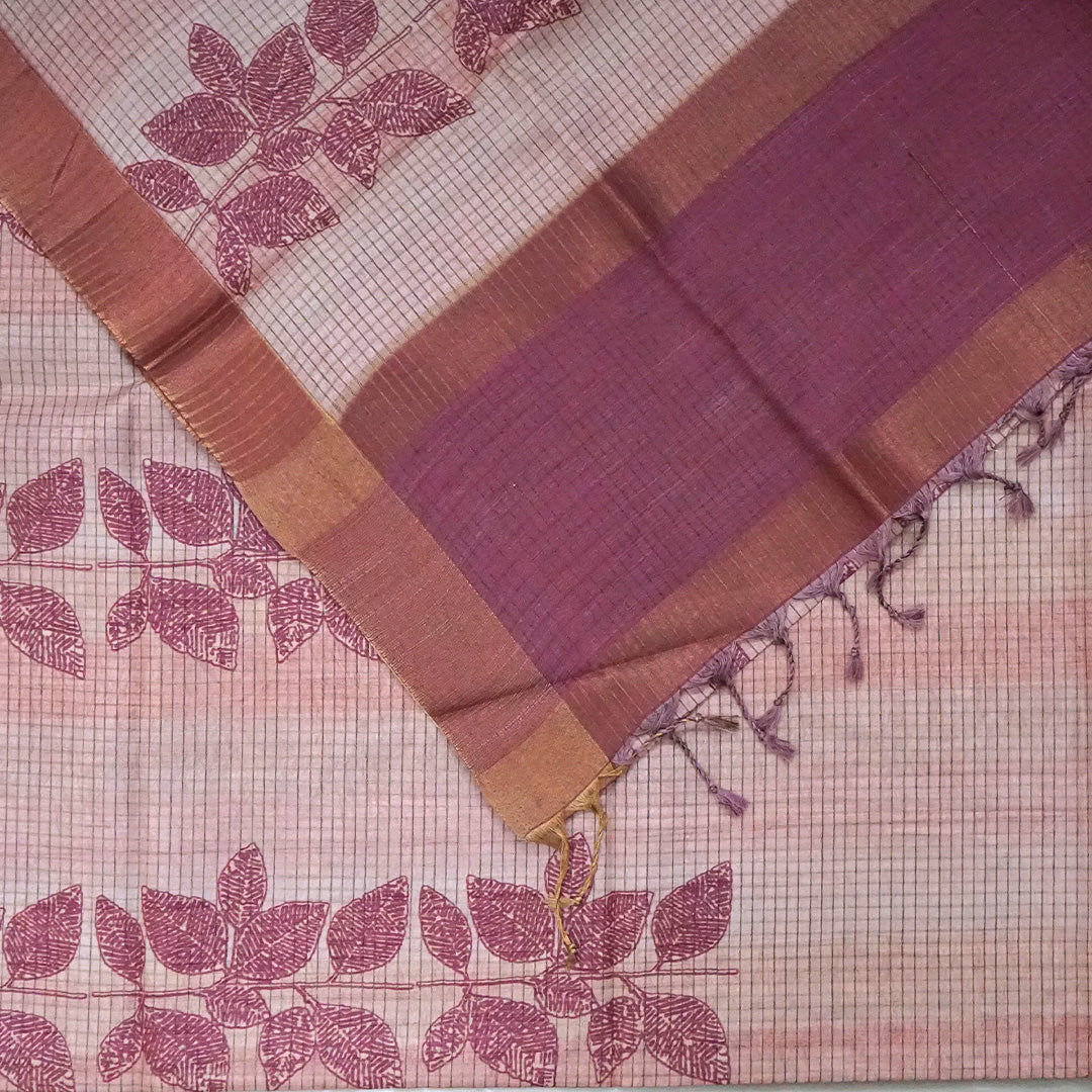 Harini Tussar in soft beige base with maroon leaf motifs and a matching brownish-maroon border, creating an elegant and earthy look.