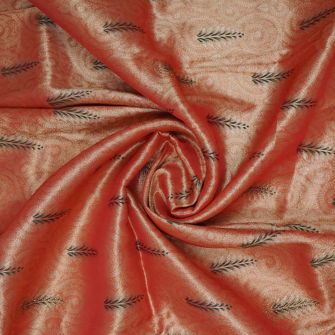 Madhur Bela rich coral-orange shade with a golden undertone.