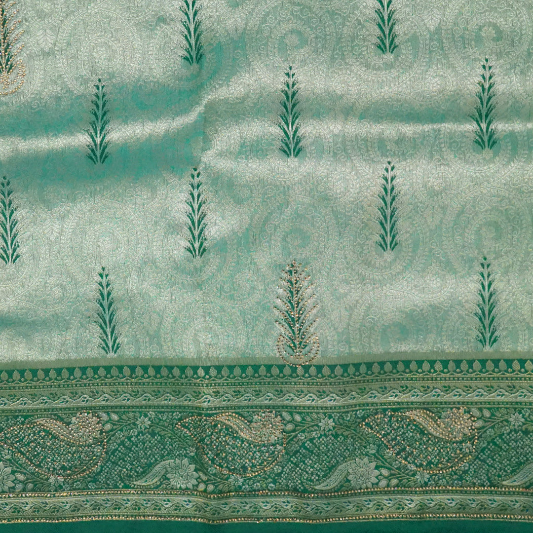 Madhur Bela soothing teal-green hue shade with a golden undertone.
