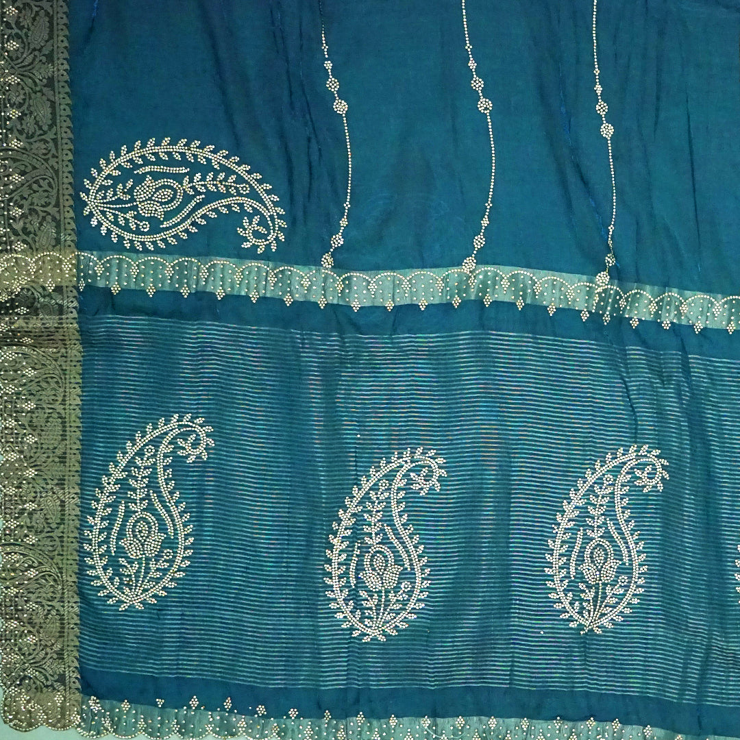Ratnalekha silk saree in rich teal-blue base adorned with intricate gold zari work,