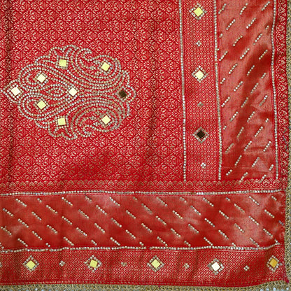 Samrudhi Silk saree in vibrant crimson red with a shimmering copper-toned border.