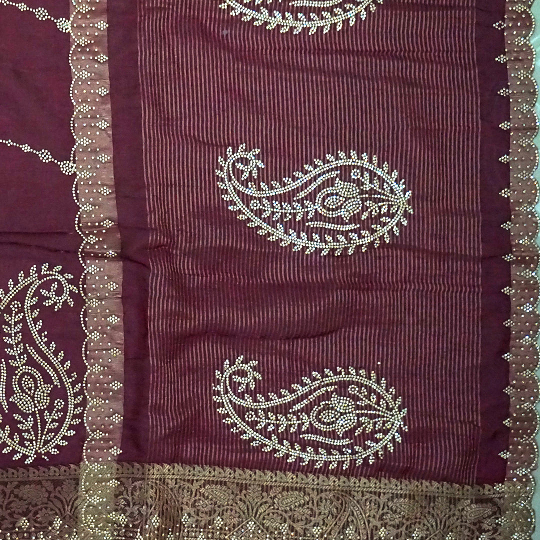 Ratnalekha Silk saree in rich wine-maroon base adorned with intricate gold zari embroidery