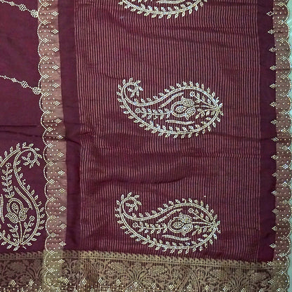 Ratnalekha Silk saree in rich wine-maroon base adorned with intricate gold zari embroidery