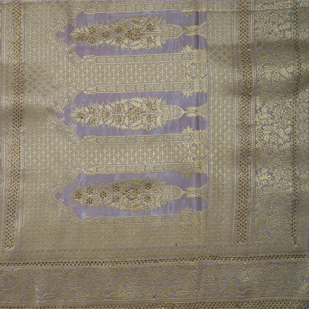 Vedika Silk saree in soft pastel pink shade with a luxurious golden zari weave.