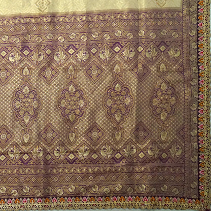 Golden cream Raj Virasat Silk saree with Deep purple base and heavy embroidery.