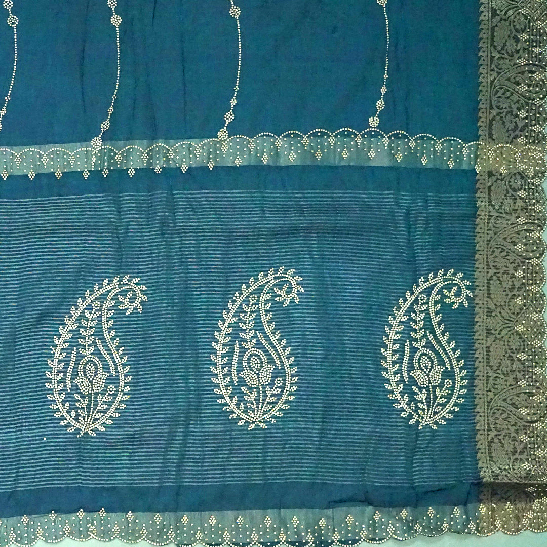 Ratnalekha silk saree in rich teal-blue base adorned with intricate gold zari work,