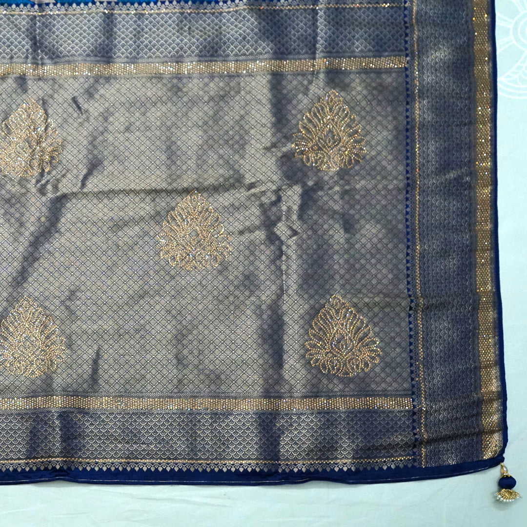 Megha Silk saree in rich royal blue with alternating metallic gold zari stripes.