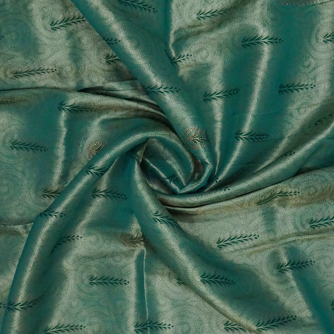 Madhur Bela soothing teal-green hue shade with a golden undertone.