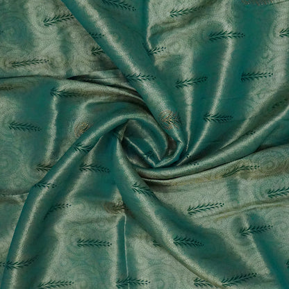Madhur Bela soothing teal-green hue shade with a golden undertone.