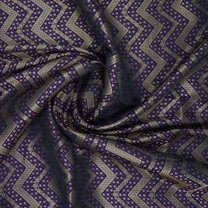 Tarani Silk saree in royal deep purple shade with a rich golden zari weave.