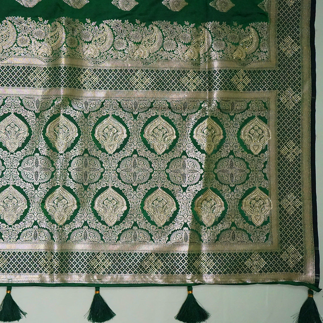 Rithvi Satin Emerald-green shade color adorned with intricate golden zari embroidery