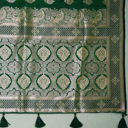 Rithvi Satin Emerald-green shade color adorned with intricate golden zari embroidery