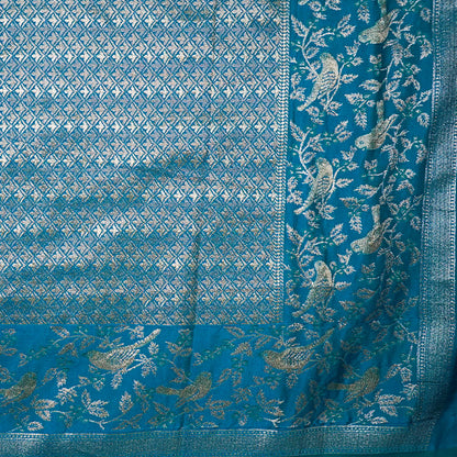 Hamsini Silk saree in Vibrant teal blue shade with a lustrous silk texture.