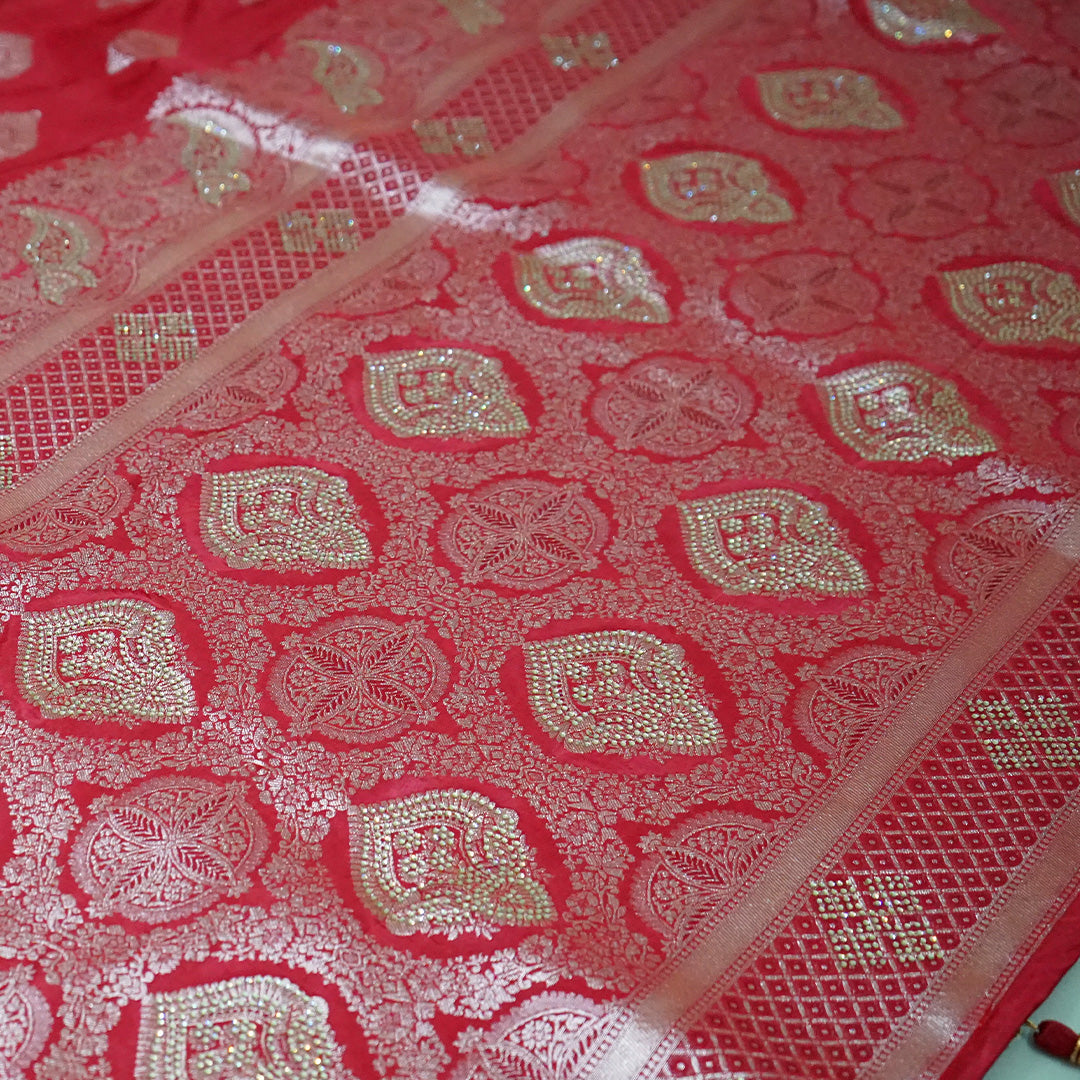 Rithvi Satin Deep red color adorned with intricate golden zari embroidery