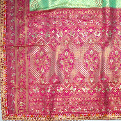 Mint Green Raj Virasat Silk saree with Deep purple base and heavy embroidery.